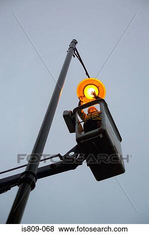 Street light maintenance View Large Photo Image Stock Photo - Street light maintenance. Fotosearch