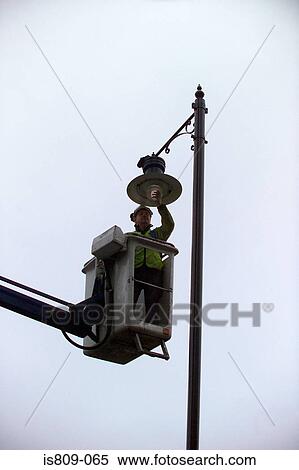 Street light maintenance View Large Photo Image Stock Photography - Street light maintenance. Fotosearch