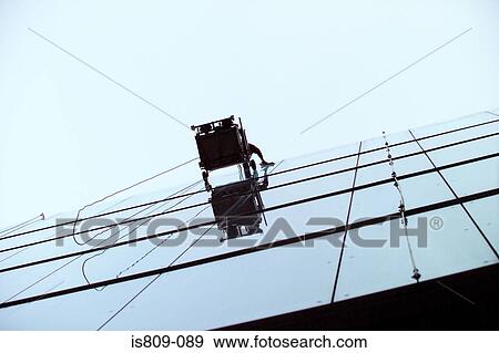 Stock Photo - Window cleaning on skyscraper. Fotosearch