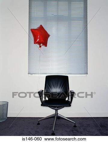 Balloon attached to office chair View Large Photo Image Stock Image - Balloon attached to office chair. Fotosearch