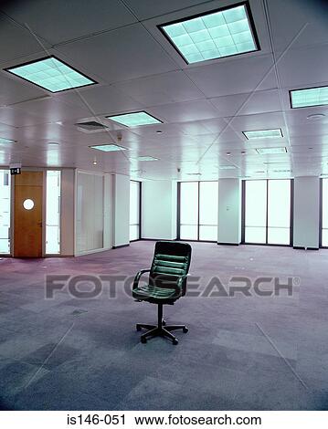 Stock Image - Chair in empty office. Fotosearch