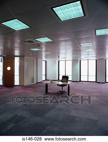 Desk in empty office View Large Photo Image Stock Photo - Desk in empty office. Fotosearch