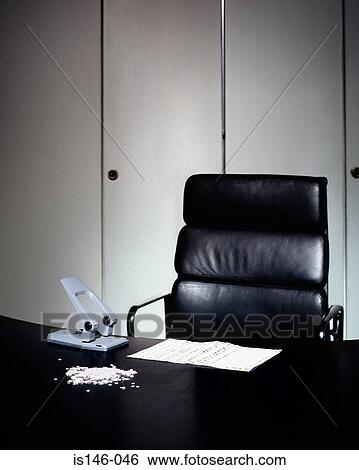 Stock Photograph - Hole punch on desk. Fotosearch