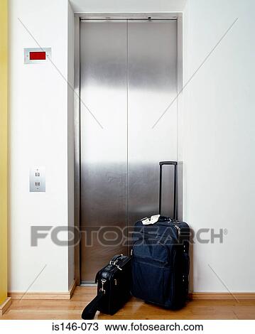 Suitcase outside elevator View Large Photo Image Stock Image - Suitcase outside elevator. Fotosearch