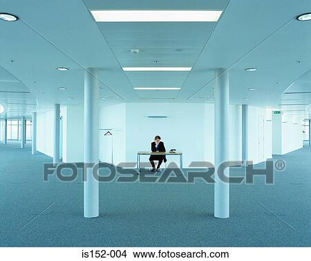 Bored businessman in office View Large Photo Image Picture - Bored businessman in office. Fotosearch
