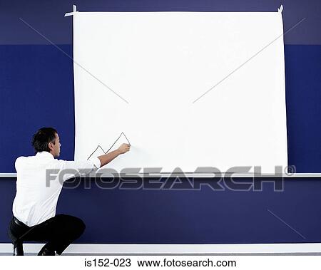 Stock Image - Businessman drawing a graph. Fotosearch