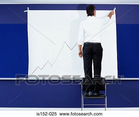 Businessman drawing a graph View Large Photo Image Stock Photography - Businessman drawing a graph. Fotosearch