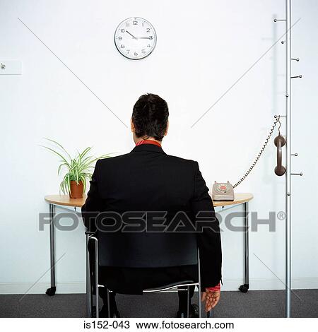 Businessman ignoring telephone View Large Photo Image Stock Image - Businessman ignoring telephone. Fotosearch