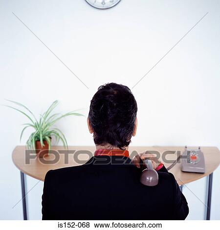 Businessman ignoring telephone View Large Photo Image Stock Photo - Businessman ignoring telephone. Fotosearch