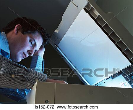 Businessman photocopying View Large Photo Image Stock Image - Businessman photocopying. Fotosearch