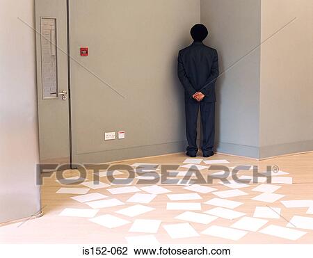 Businessman trapped by documents in office View Large Photo Image Stock Image - Businessman trapped by documents in office. Fotosearch