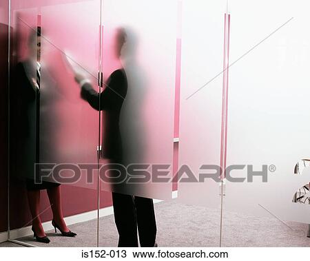 Businesspeople discussing document View Large Photo Image Stock Image - Businesspeople discussing document. Fotosearch