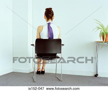 Businesswoman sitting in corner View Large Photo Image Stock Photo - Businesswoman sitting in corner. Fotosearch