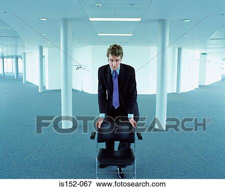 Hostile looking businessman View Large Photo Image Stock Photo - Hostile looking businessman. Fotosearch