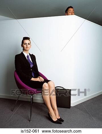 Man peering at businesswoman View Large Photo Image Stock Image - Man peering at businesswoman. Fotosearch