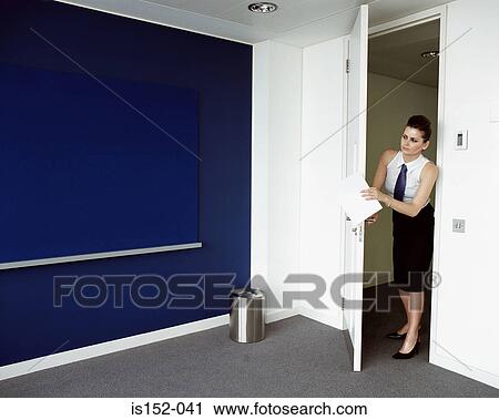 Woman opening door to office View Large Photo Image Stock Image - Woman opening door to office. Fotosearch