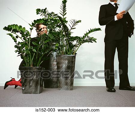 Woman spying on businessman View Large Photo Image Stock Image - Woman spying on businessman. Fotosearch