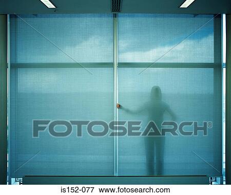 Woman standing behind blue screen View Large Photo Image Stock Photo - Woman standing behind blue screen. Fotosearch