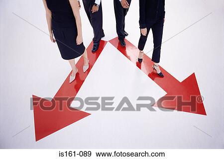 Four people walking along arrow signs View Large Photo Image Stock Photo - Four people walking along arrow signs. Fotosearch