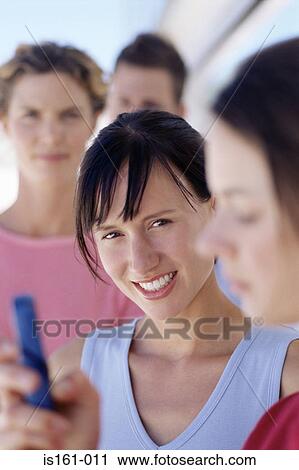 Office worker with her colleagues View Large Photo Image Stock Image - Office worker with her colleagues. Fotosearch