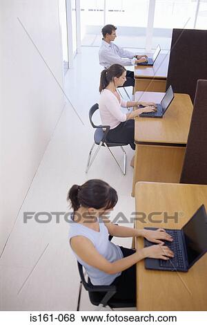 Stock Photo - People working in an office. Fotosearch