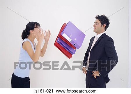 Woman throwing folders at man View Large Photo Image Stock Image - Woman throwing folders at man. Fotosearch