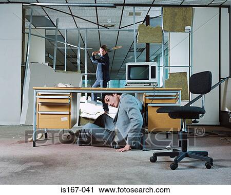 Businessman hiding from colleague's attack View Large Photo Image Stock Image - Businessman hiding from colleague's attack. Fotosearch