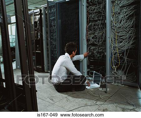 Man adjusting electrical cables View Large Photo Image Stock Photo - Man adjusting electrical cables. Fotosearch