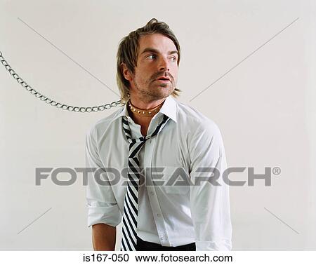 Stock Image - Office worker wearing a dog collar and lead. Fotosearch