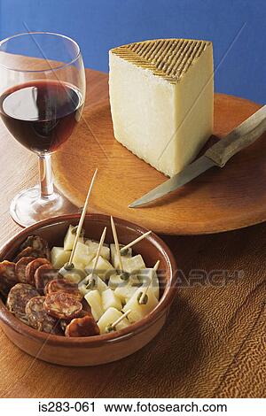 Cheese chorizo and a glass of wine View Large Photo Image Stock Image - Cheese chorizo and a glass of wine. Fotosearch