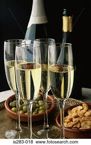 Glasses of cava and snacks View Large Photo Image Stock Photo - Glasses of cava and snacks. Fotosearch