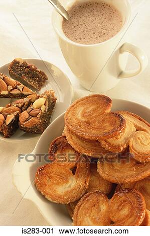 Stock Image - Hot chocolate and palmitos. Fotosearch