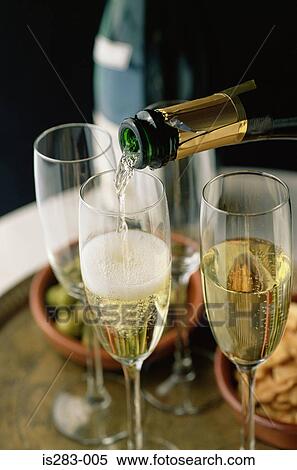 Pouring glasses of cava View Large Photo Image Stock Photography - Pouring glasses of cava. Fotosearch
