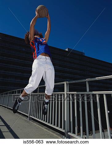 Basketball player jumping View Large Photo Image Stock Image - Basketball player jumping. Fotosearch