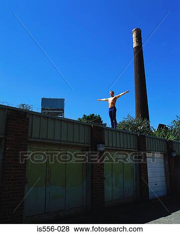 Gymnast on garage roof View Large Photo Image Stock Photo - Gymnast on garage roof. Fotosearch