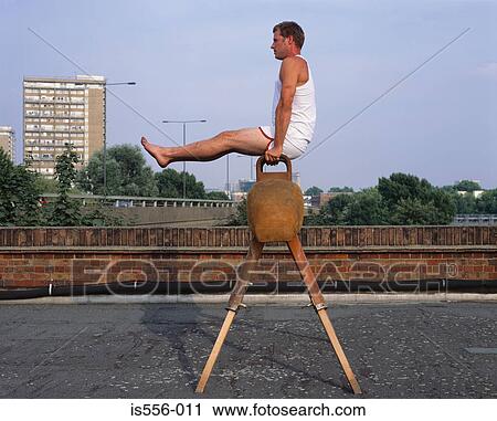 Gymnast on roof View Large Photo Image Stock Image - Gymnast on roof. Fotosearch