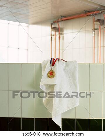 Medal and towel on wall View Large Photo Image Stock Photo - Medal and towel on wall. Fotosearch