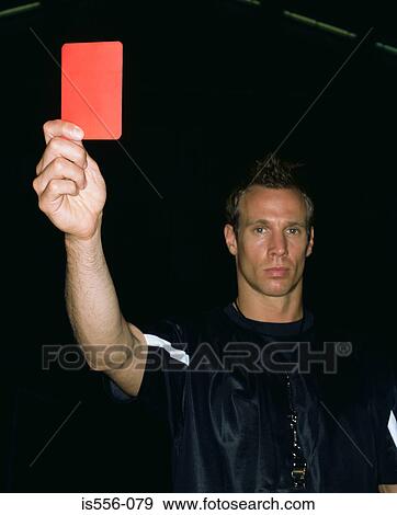Referee holding a red card View Large Photo Image Stock Photo - Referee holding a red card. Fotosearch