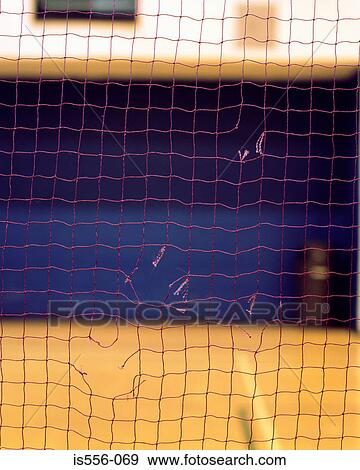 Stock Photo - Torn net in gymnasium. Fotosearch