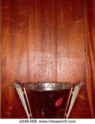 Stock Photo - Trophy against wooden wall. Fotosearch