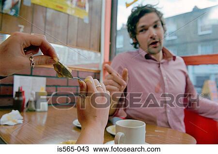 Couple playing in cafe View Large Photo Image Stock Image - Couple playing in cafe. Fotosearch