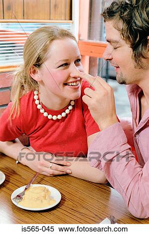 Couple playing in cafe View Large Photo Image Stock Photography - Couple playing in cafe. Fotosearch