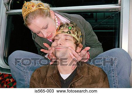 Couple playing on subway train View Large Photo Image Stock Image - Couple playing on subway train. Fotosearch