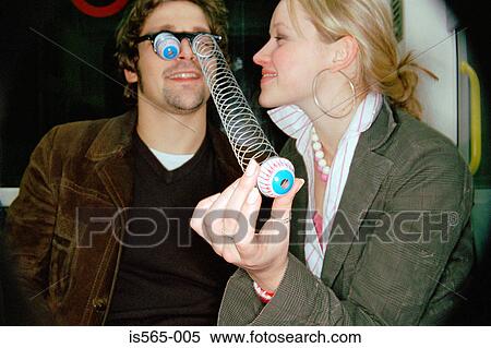 Couple playing on subway train View Large Photo Image Stock Photography - Couple playing on subway train. Fotosearch