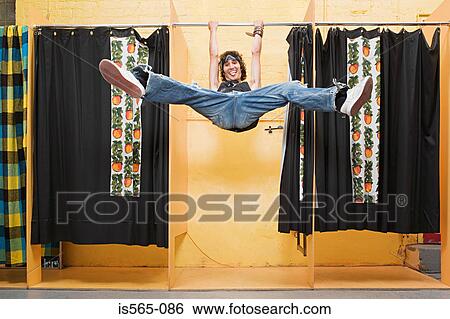 Man playing in changing room View Large Photo Image Stock Photograph - Man playing in changing room. Fotosearch