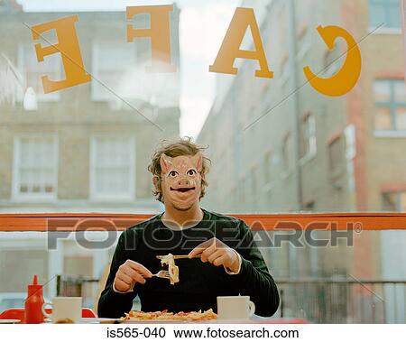 Man wearing face mask in cafe View Large Photo Image Stock Image - Man wearing face mask in cafe. Fotosearch