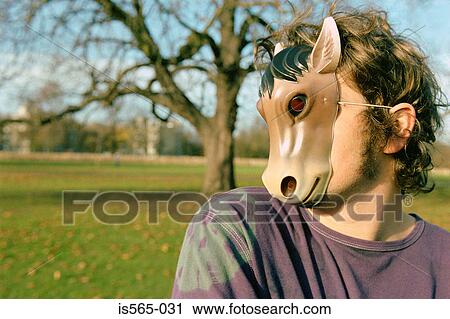Man wearing horse mask View Large Photo Image Stock Image - Man wearing horse mask . Fotosearch