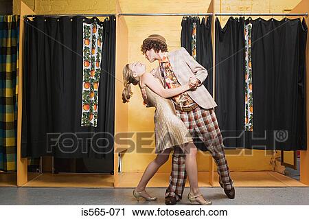 Retro couple dancing in clothes store View Large Photo Image Stock Image - Retro couple dancing in clothes store. Fotosearch