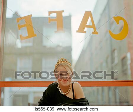 Stock Photo - Smiling woman in cafe. Fotosearch
