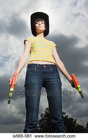 Woman playing with toy guns View Large Photo Image Stock Image - Woman playing with toy guns. Fotosearch